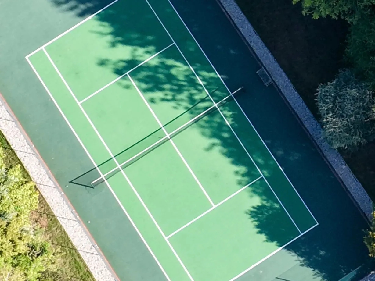 Detail B: Tennis court net and lines, enlarged from the full photo